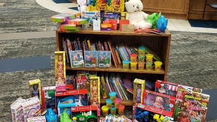 The BLC Community Bank team gathered books and toys to donate to the Children's Hospital.