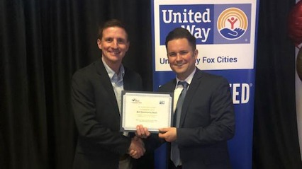 Adam Lange receives an award on behalf of BLC Community Bank from United Way.