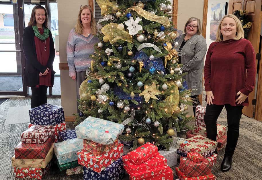Members of BLC’s third quarter fundraising team show the gifts that were bought for the two families we adopted this Christmas.