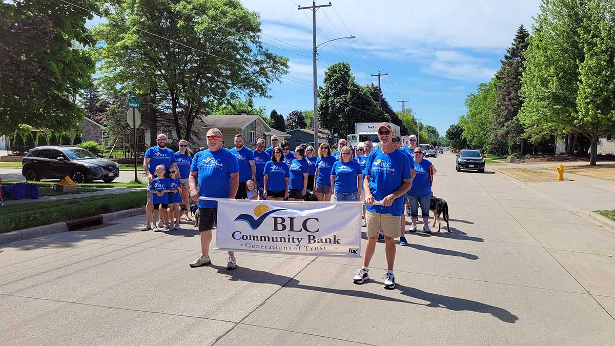 BLC employees and their families walk in the annual Little Chute Cheesefest Parade.