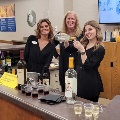 Ladies from team BLC volunteer for the Little Chute Wine Walk.